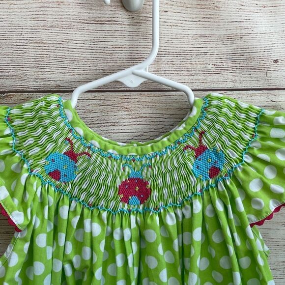 STITCHED AND SMOCKED GREEN AND WHITE POLKA DOT DRESS WITH EMBROIDERED LADYBUGS - Picture 7 of 9